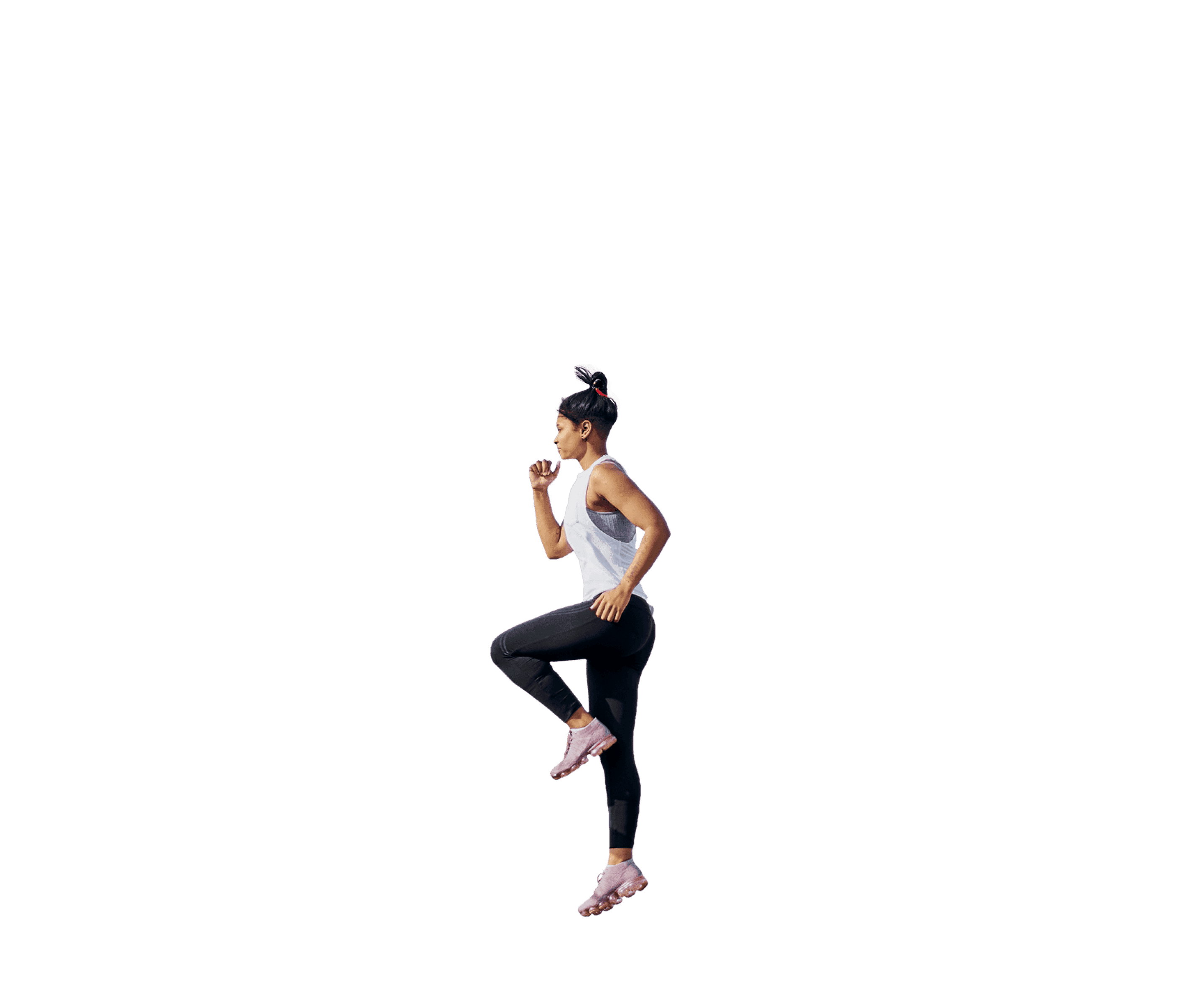 Woman performing high knee jump